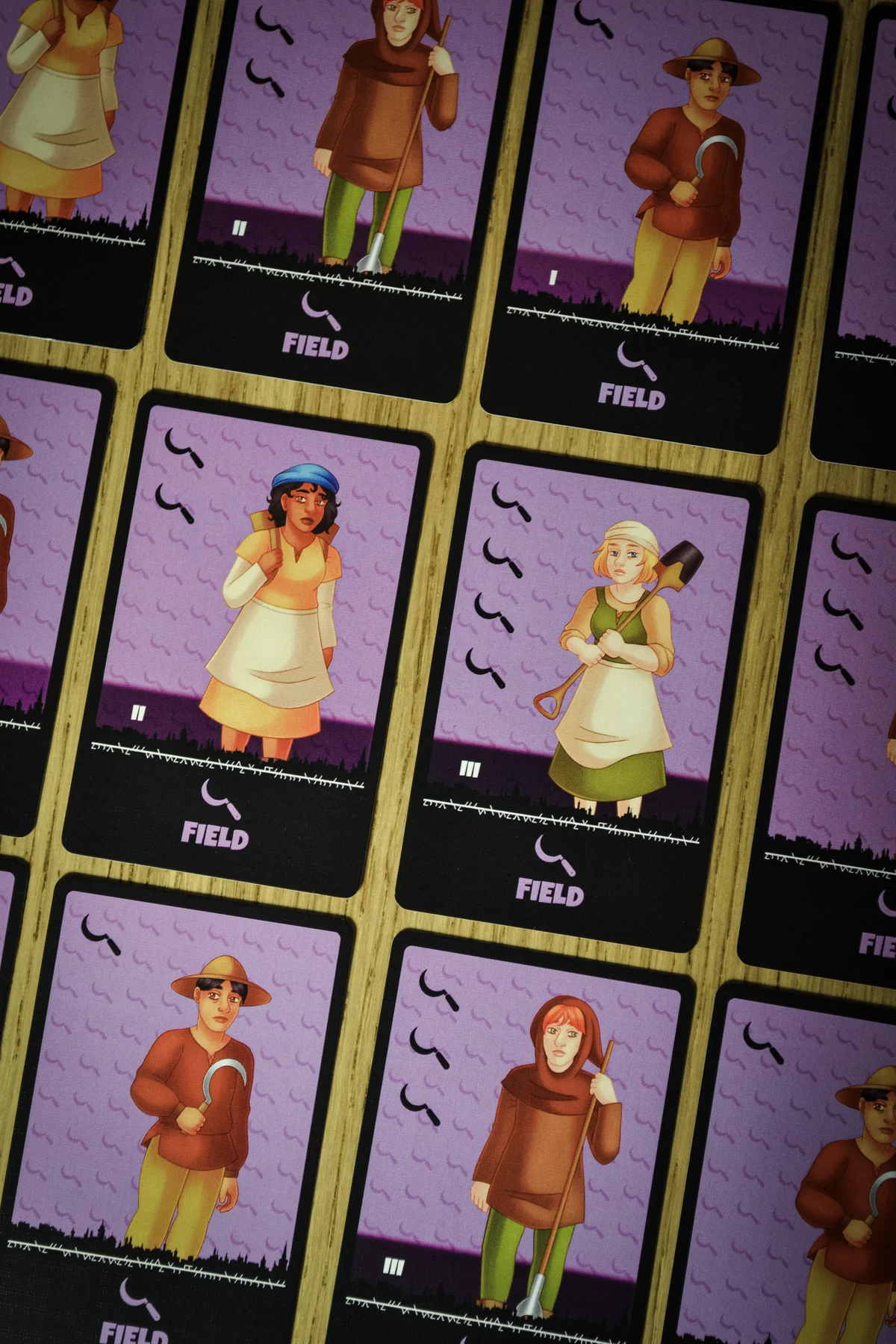 Close-up of illustrated purple Field People tiles