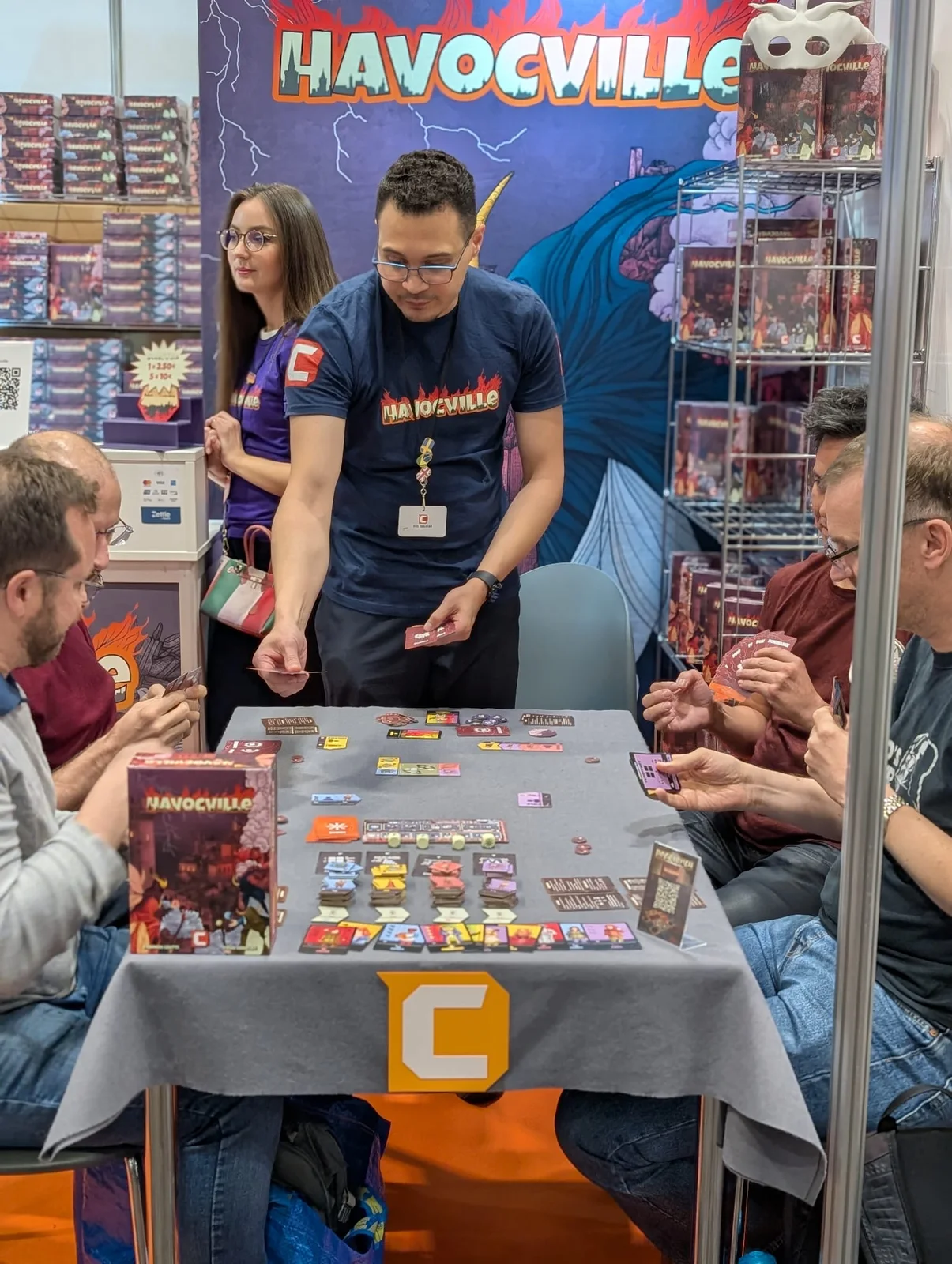 Players learning Havocville together at Spiel Essen 2025