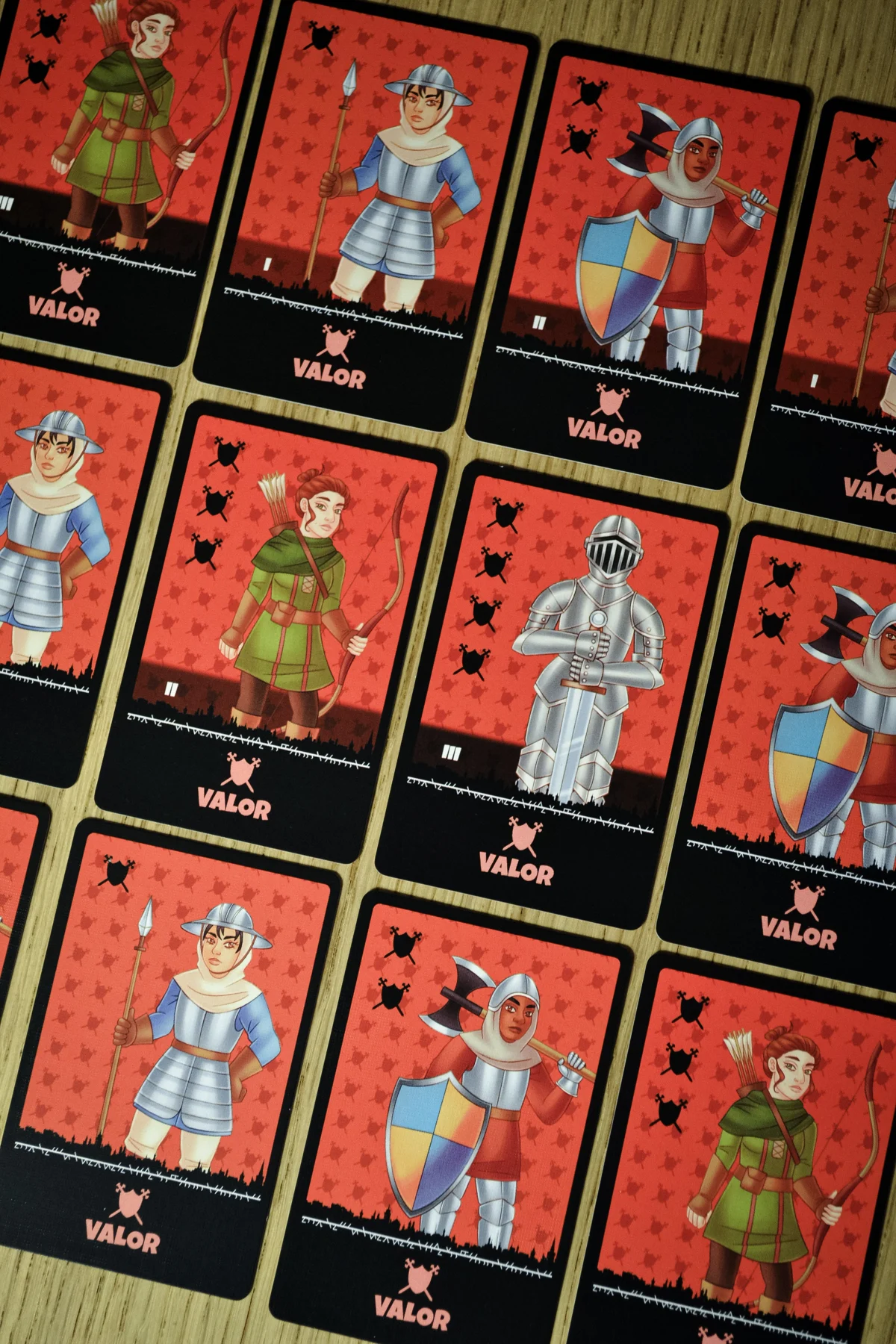 Close-up of red Valor People tiles showing warriors and knights