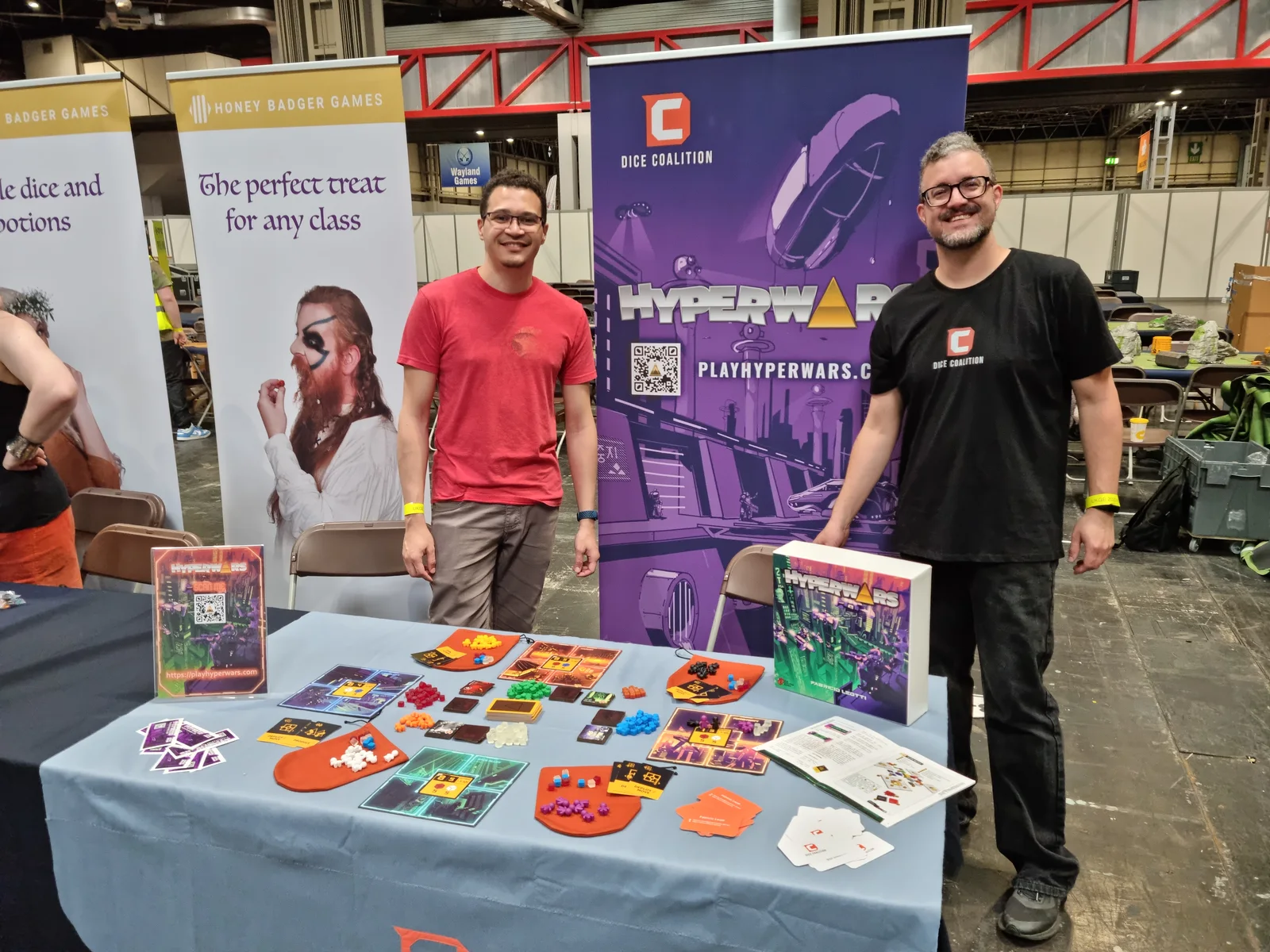 The Dice Coalition team beside Hyperwars at UK Games Expo